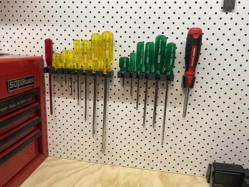 Stanley screwdriver mounting for pegboard storage system.